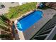 Inviting kidney-shaped pool with surrounding landscaping at 8449 Kettledrum St, Las Vegas, NV 89139