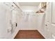 Large walk-in closet with double hanging rods and wood flooring at 8449 Kettledrum St, Las Vegas, NV 89139