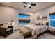 Well-lit bedroom with neutral tones, carpet flooring, comfortable furnishings, and natural light at 8560 Foundry Branch Ln, Las Vegas, NV 89113