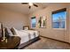 Cozy bedroom featuring neutral tones, a ceiling fan, and carpet at 8560 Foundry Branch Ln, Las Vegas, NV 89113