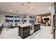 Open-concept kitchen with a center island, modern appliances, and adjacent dining area at 8560 Foundry Branch Ln, Las Vegas, NV 89113