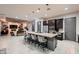 Open-concept kitchen with a granite counter island, modern appliances, and an eating bar at 8560 Foundry Branch Ln, Las Vegas, NV 89113