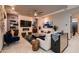 Modern living room featuring stylish decor, fireplace, tile flooring, and an open, airy atmosphere at 8560 Foundry Branch Ln, Las Vegas, NV 89113