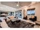 Bright and airy living room offering comfortable seating, a modern design, and seamless transition to the outdoors at 8560 Foundry Branch Ln, Las Vegas, NV 89113