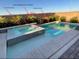 In-ground pool and hot tub are surrounded by lush landscaping at 8560 Foundry Branch Ln, Las Vegas, NV 89113