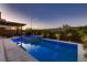 Backyard swimming pool and outdoor kitchen featuring landscaped palm trees at 8560 Foundry Branch Ln, Las Vegas, NV 89113