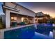 Sparkling pool and spa with covered patio and outdoor kitchen at 8560 Foundry Branch Ln, Las Vegas, NV 89113