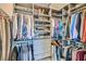 Spacious walk-in closet featuring custom shelving and drawer organization at 8560 Foundry Branch Ln, Las Vegas, NV 89113