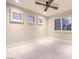 Bright bedroom features a ceiling fan and multiple shuttered windows for lots of natural light at 8808 Rozetta Ct, Las Vegas, NV 89134