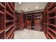 Spacious walk-in closet features custom wood shelving and ample storage space at 8808 Rozetta Ct, Las Vegas, NV 89134