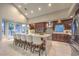 Beautiful kitchen with marble countertop island, stainless steel appliances, dark cabinetry, and pendant lighting at 8808 Rozetta Ct, Las Vegas, NV 89134