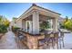 Outdoor bar with seating near the pool with granite counters and stacked stone at 8808 Rozetta Ct, Las Vegas, NV 89134