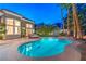 Stunning backyard pool with mature landscaping and a cozy seating area with an abundance of privacy at 8808 Rozetta Ct, Las Vegas, NV 89134