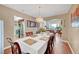 Dining room with hardwood floors, chandelier, open to kitchen and living room at 8908 Rocky Shore Dr, Las Vegas, NV 89117