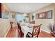 A dining room with seating for six, hardwood floors, chandelier and tasteful decor at 8908 Rocky Shore Dr, Las Vegas, NV 89117