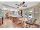 Open kitchen with skylight, granite counters, breakfast table and sliding doors to the patio at 8908 Rocky Shore Dr, Las Vegas, NV 89117