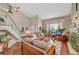 Bright living room with vaulted ceiling, hardwood floors, neutral color palette and plenty of natural light at 8908 Rocky Shore Dr, Las Vegas, NV 89117