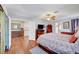 Spacious main bedroom with wood flooring, ceiling fan, and sliding patio doors at 8908 Rocky Shore Dr, Las Vegas, NV 89117