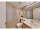 Well-lit half bathroom featuring a sink, toilet, and decorative accents at 928 Allure Dr, Las Vegas, NV 89128