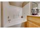 Clean bathroom featuring a white tiled shower and vanity with modern fixtures at 928 Allure Dr, Las Vegas, NV 89128