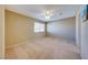 Spacious bedroom with neutral carpet, a ceiling fan, and a bright window with blinds at 928 Allure Dr, Las Vegas, NV 89128