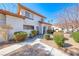 Two-story townhouse featuring a landscaped front yard and cozy curb appeal at 928 Allure Dr, Las Vegas, NV 89128