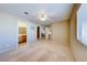 Spacious main bedroom with a ceiling fan, ensuite bathroom, and natural light at 928 Allure Dr, Las Vegas, NV 89128