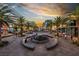 Stunning sunset view of town center fountain, palm trees and shops perfect for evening strolls at 928 Allure Dr, Las Vegas, NV 89128