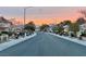 Street view of the community during a vibrant sunset at 9437 January Dr, Las Vegas, NV 89134