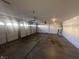 Spacious three car garage with automatic door and room for storage or projects at 9543 Antelope Bend Ct, Las Vegas, NV 89148