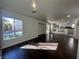 Sunlit living room features hardwood floors and large window overlooking the landscaped backyard at 9543 Antelope Bend Ct, Las Vegas, NV 89148