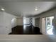 Bright living room with recessed lighting and hardwood floors flows out to a covered patio at 9543 Antelope Bend Ct, Las Vegas, NV 89148