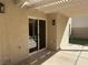 A covered patio area features stucco wall, lighting, and an adjacent yard area at 9543 Antelope Bend Ct, Las Vegas, NV 89148