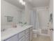 Bathroom features double sinks, white cabinets, shower, and coordinating faucets at 10089 Bismuth St, Las Vegas, NV 89183