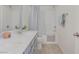 Bright bathroom with double sink vanity, ample lighting, and shower-tub combination at 10089 Bismuth St, Las Vegas, NV 89183