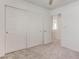 Bedroom features a carpeted floor, a paneled closet, and an open door at 10089 Bismuth St, Las Vegas, NV 89183