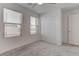 Bright bedroom features plush carpeting, large windows, and a spacious closet for ample storage at 10089 Bismuth St, Las Vegas, NV 89183