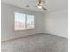 Bedroom offers a large window, ceiling fan, plush carpets and lots of room at 10089 Bismuth St, Las Vegas, NV 89183