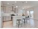 Modern kitchen featuring an island with bar seating, stainless steel appliances, and seamless access to outdoor living at 10089 Bismuth St, Las Vegas, NV 89183