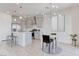 Kitchen with island and stainless steel appliances, complemented by an adjacent dining area at 10089 Bismuth St, Las Vegas, NV 89183