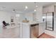Contemporary kitchen with stainless steel appliances, island with bar seating, and open layout at 10089 Bismuth St, Las Vegas, NV 89183