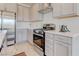 Stylish kitchen featuring stainless steel appliances, gray cabinets, and modern fixtures at 10089 Bismuth St, Las Vegas, NV 89183