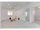 Bright living room featuring plush carpet, recessed lighting, and a cozy atmosphere at 10089 Bismuth St, Las Vegas, NV 89183