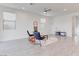 Bright, open living room featuring neutral walls, tile floors, and minimalist decor, creating a relaxing atmosphere at 10089 Bismuth St, Las Vegas, NV 89183
