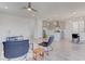 Open living area with tile flooring, recessed lighting, seamlessly flowing into the kitchen and dining area at 10089 Bismuth St, Las Vegas, NV 89183