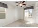 Well-lit bedroom with neutral walls, carpet, and natural light from multiple windows at 10221 Mayflower Bay Ave, Las Vegas, NV 89166