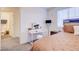 Inviting bedroom with natural light, plush bedding, and adjacent bathroom at 1132 Ruby Sparrow St, Henderson, NV 89011