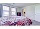 Bedroom with carpet flooring, windows, bed and views of the en suite bathroom at 1132 Ruby Sparrow St, Henderson, NV 89011