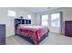 Cozy bedroom featuring natural light, carpet flooring, and ample closet space at 1132 Ruby Sparrow St, Henderson, NV 89011