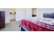 Cozy bedroom featuring carpet flooring and an open view to the bathroom at 1132 Ruby Sparrow St, Henderson, NV 89011